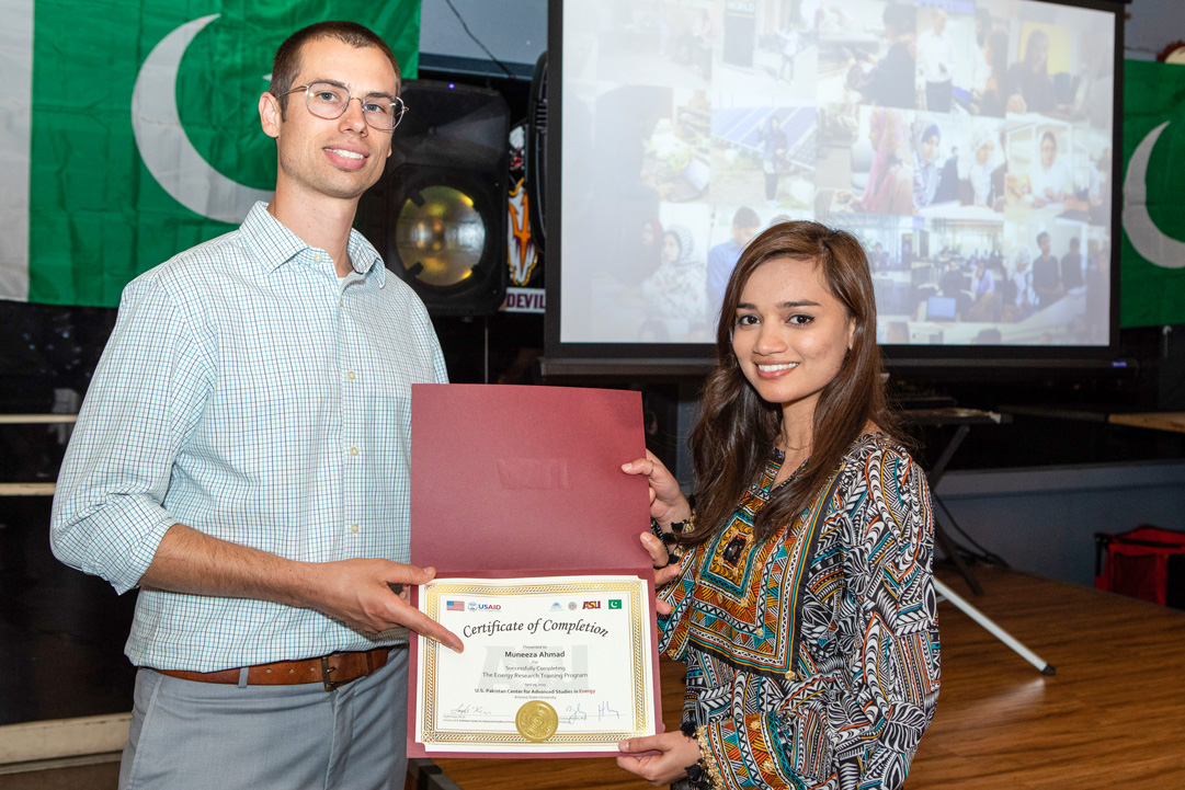 USPCAS-E Scholar Muneeza Ahmad receives completion certificate from Dr. Zachary Holman at ASU