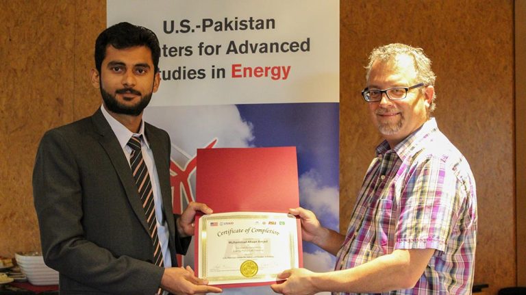 M. Ahsan receives his certificate of completion for the exchange program in the U.S.